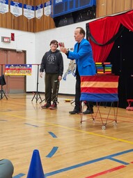 Steve Harmer doing magic with a student