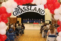 Kindergarten and Grade 9 students on the stage